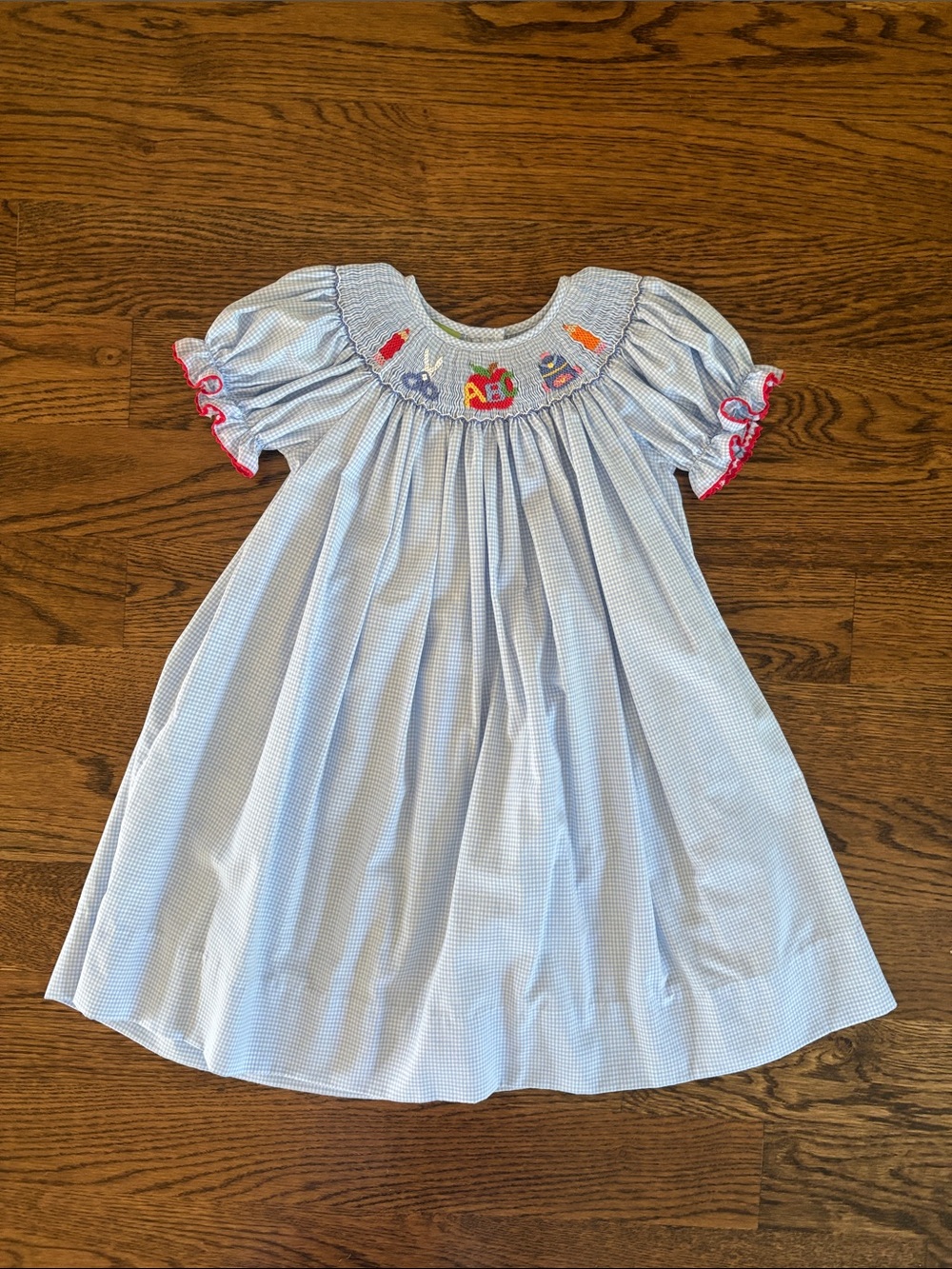 Light Blue Smocked Short-Sleeve Kids Dress with Red Trim Accents